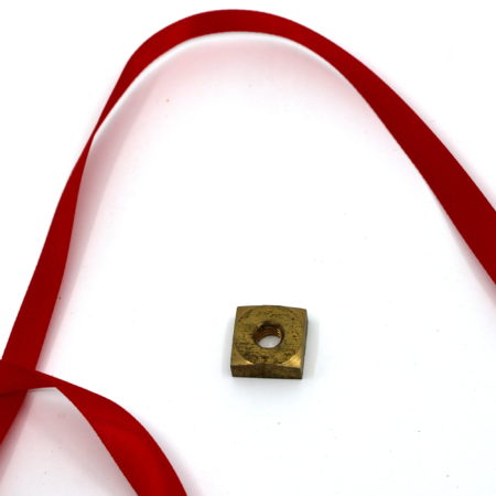 Brass Nut Release by Supreme Magic Company, Brema